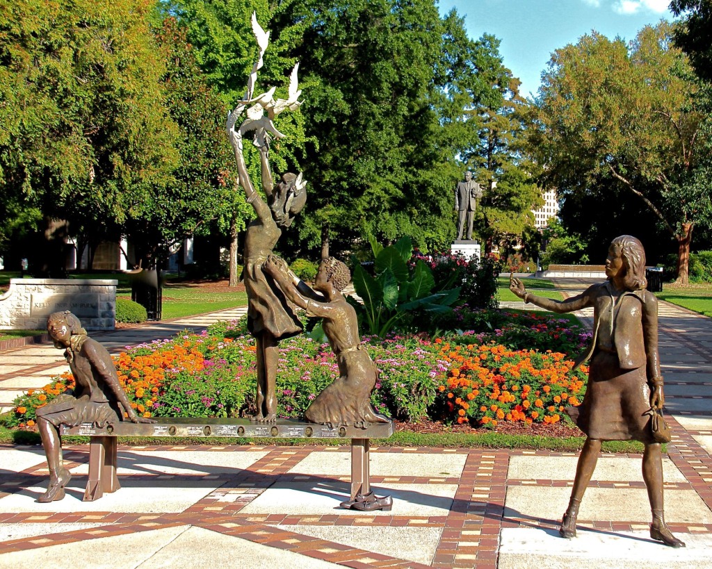 bronze art installation at Kelly Ingram Park representing the four girls killed in the 16th Street Baptist Church bombing on September 15, 1963, in Birmingham Alabama. The girls are depicted in play with one reaching for a group of ascending doves.